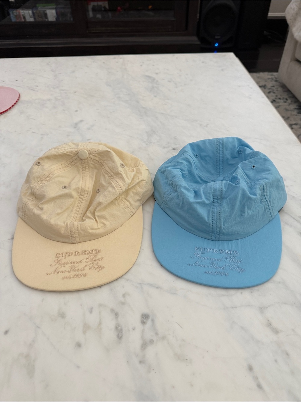 Supreme Embroidered Script Caps in Cream and Baby Blue